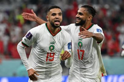 Moroccos forward #19 Youssef En-Nesyri celebrates with midfielder #17 Sofiane Boufal after scoring his teams second goal during the Qatar 2022 World Cup Group F football match between Canada and Morocco at the Al-Thumama Stadium in Doha on December 1, 2022. (Photo by Patrick T. Fallon / AFP)Editoria: SPOLocal: DohaIndexador: PATRICK T. FALLONSecao: soccerFonte: AFPFotógrafo: STF<!-- NICAID(15282171) -->