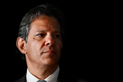 Brazilian future Economy Minister Fernando Haddad gestures during a press conference at the transitional government building in Brasilia, on December 9, 2022. - President-elect Luiz Inácio Lula da Silva revealed on Friday the main names of his future government, including former Sao Paulo mayor Fernando Haddad as the Economy Minister and former Minister Mauro Vieira for Foreign Affairs. (Photo by EVARISTO SA / AFP)<!-- NICAID(15291262) -->