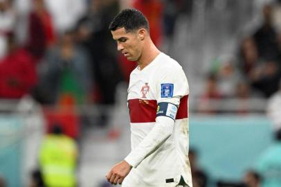 Portugals forward #07 Cristiano Ronaldo reacts after losing  the Qatar 2022 World Cup quarter-final football match between Morocco and Portugal at the Al-Thumama Stadium in Doha on December 10, 2022. (Photo by PATRICIA DE MELO MOREIRA / AFP)<!-- NICAID(15292084) -->