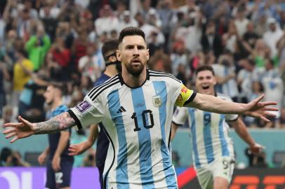 Argentinas forward #10 Lionel Messi celebrates scoring his teams first goal from the penalty spot during the Qatar 2022 World Cup football semi-final match between Argentina and Croatia at Lusail Stadium in Lusail, north of Doha on December 13, 2022. (Photo by JACK GUEZ / AFP)<!-- NICAID(15294328) -->