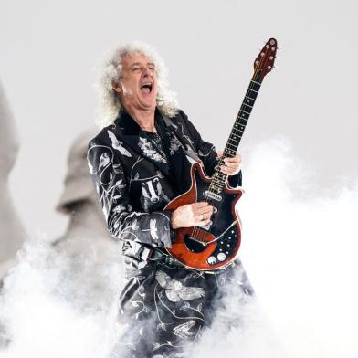 (FILES) In this file photo taken on June 4, 2022 British guitarist Brian May of Queen performs during the Platinum Party at Buckingham Palace as part of Queen Elizabeth IIs platinum jubilee celebrations. - Brian May, guitarist of the rock band Queen, is one of 1,107 people who have been awarded this year in a list signed for the first time by King Charles III. These royal awards are given twice a year, on New Years Day and on the Kings official birthday, always celebrated in June, regardless of the monarchs actual date of birth (14 November 1948 for Charles III). (Photo by Alberto Pezzali / POOL / AFP)<!-- NICAID(15309989) -->