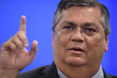 Brazilian Justice and Public Security Minister Flavio Dino gestures during a press conferente at the Justice Palace in Brasilia on January 9, 2023, a day after supporters of Brazils far-right ex-president Jair Bolsonaro invaded the Congress, presidential palace and Supreme Court. - Brazilian security forces locked down the area around Congress, the presidential palace and the Supreme Court Monday, a day after supporters of ex-president Jair Bolsonaro stormed the seat of power in riots that triggered an international outcry. Hardline Bolsonaro supporters have been protesting outside army bases calling for a military intervention to stop Lula from taking power since his election win. (Photo by CARL DE SOUZA / AFP)Editoria: POLLocal: BrasíliaIndexador: CARL DE SOUZASecao: politics (general)Fonte: AFPFotógrafo: STF<!-- NICAID(15316250) -->