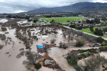 SALINAS, CALIFORNIA - JANUARY 13: In an aerial view, floodwaters cover an agricultural area after the Salinas River overflowed its banks on January 13, 2023 in Salinas, California. Several atmospheric river events continue to pound California with record rainfall and high winds.   Justin Sullivan/Getty Images/AFP (Photo by JUSTIN SULLIVAN / GETTY IMAGES NORTH AMERICA / Getty Images via AFP)<!-- NICAID(15321785) -->