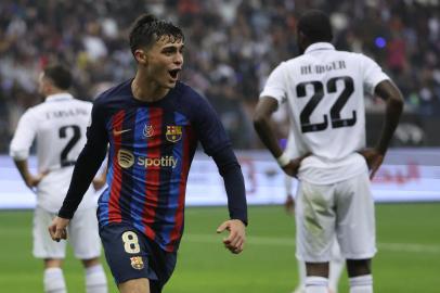 Barcelonas Spanish midfielder Pedri celebrates after scoring his teams third goal during the Spanish Super Cup final football match between Real Madrid CF and FC Barcelona at the King Fahd International Stadium in Riyadh, Saudi Arabia, on January 15, 2023. (Photo by Giuseppe CACACE / AFP)Editoria: SPOLocal: RiyadhIndexador: GIUSEPPE CACACESecao: soccerFonte: AFPFotógrafo: STF<!-- NICAID(15322058) -->