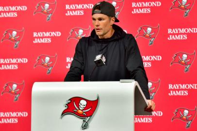 TAMPA, FLORIDA - JANUARY 16: Tom Brady #12 of the Tampa Bay Buccaneers speaks to the media after losing to the Dallas Cowboys 31-14 in the NFC Wild Card playoff game at Raymond James Stadium on January 16, 2023 in Tampa, Florida.   Julio Aguilar/Getty Images/AFP <!-- NICAID(15323265) -->