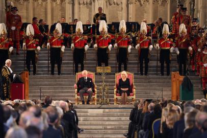 (FILES) In this file photo taken on September 12, 2022 Britains King Charles III and Britains Camilla, Queen Consort attend the presentation of Addresses by both Houses of Parliament in Westminster Hall, inside the Palace of Westminster, central London, following the death of Queen Elizabeth II on September 8. - The coronation weekend for King Charles III, that will take place on May 6, 2023, will feature a star-studded concert, nationwide big lunch and volunteering initiative as well as the traditional ceremony and royal processions, Buckingham Palace announced late on January 21, 2022. (Photo by Ian Vogler / POOL / AFP)<!-- NICAID(15328193) -->