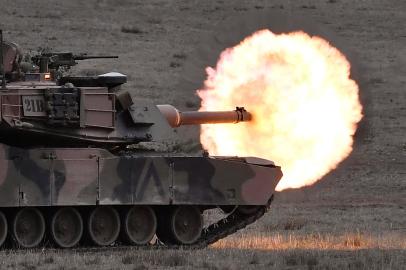 (FILES) In this file photo taken on May 09, 2019, an Australian army M1A1 Abrams main battle tank fires a round at a target during Excercise Chong Ju, a live fire demonstration showcasing the armys joint combined arms capabilities at the Puckapunyal Military Base some 100 kilometres north of Melbourne. - US President Joe Biden announced on January 25, 2023, the US will send 31 Abrams tanks to Ukraine. (Photo by WILLIAM WEST / AFP)<!-- NICAID(15331142) -->