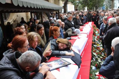 Mourners attend the funeral of seven Cypriot students killed in an earthquake that hit Turkey, on February 10, 2023 in Famagusta, in the breakaway Turkish Cypriot statelet of northern Cyprus. - Two dozen children aged 11 to 14 from the island, along with 10 parents, four teachers and a volleyball coach, were in the southern Turkish city of Adiyaman when the quake hit. The 7.8-magnitude tremor, whose epicentre was near Gaziantep, about 130 kilometres (80 miles) southwest of Adiyaman, has claimed the lives of more than 21,000 people in Turkey and Syria. (Photo by Birol BEBEK / AFP) / The erroneous mention[s] appearing in the metadata of this photo by Birol BEBEK has been modified in AFP systems in the following manner: [in Famagusta] instead of [in Nicosia]. Please immediately remove the erroneous mention[s] from all your online services and delete it (them) from your servers. If you have been authorized by AFP to distribute it (them) to third parties, please ensure that the same actions are carried out by them. Failure to promptly comply with these instructions will entail liability on your part for any continued or post notification usage. Therefore we thank you very much for all your attention and prompt action. We are sorry for the inconvenience this notification may cause and remain at your disposal for any further information you may require.<!-- NICAID(15347165) -->